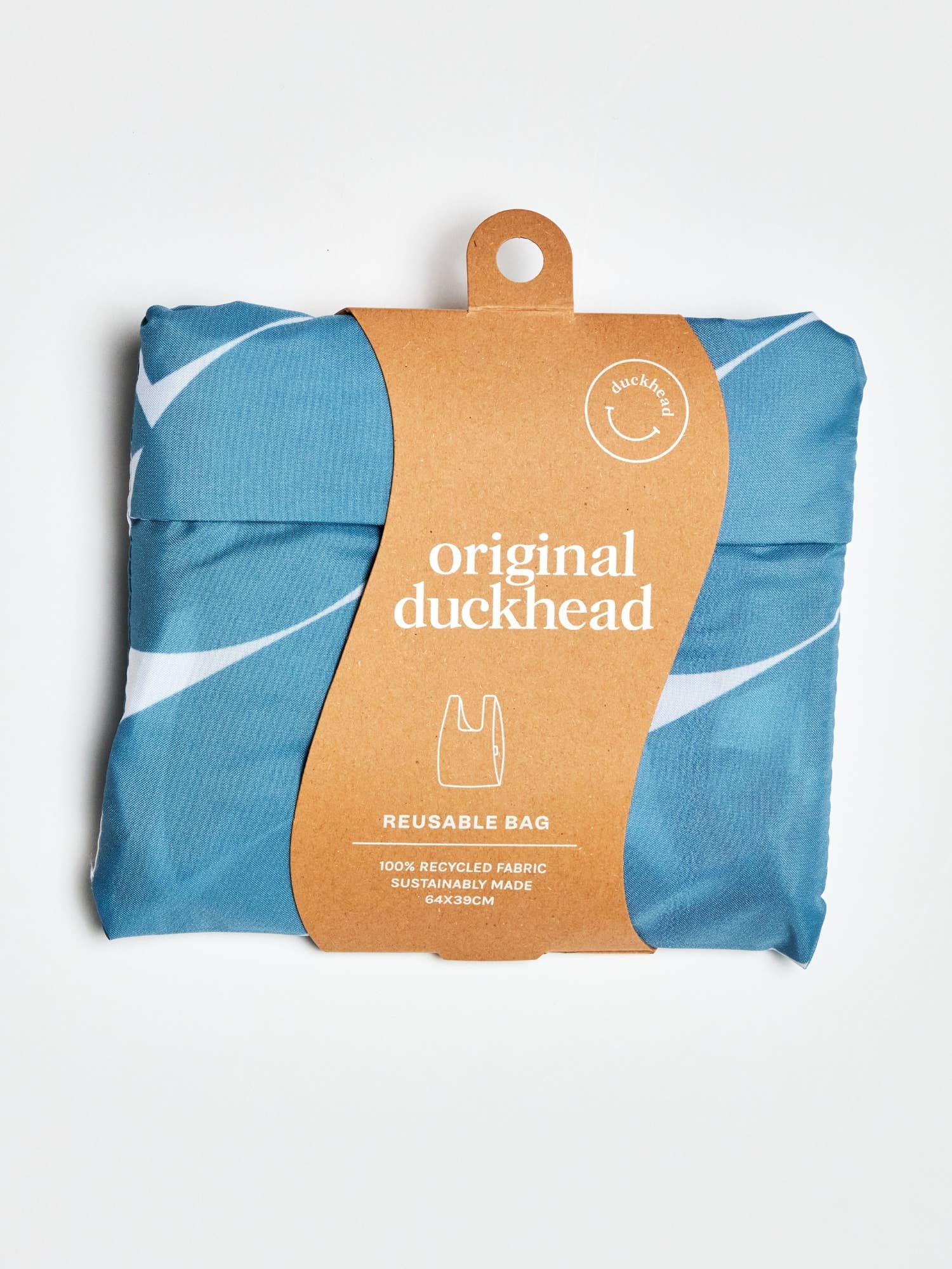 Pakket Denim Moon-gjenbruksbag med etiketten "Original Duckhead" og bærekraftsinformasjon.